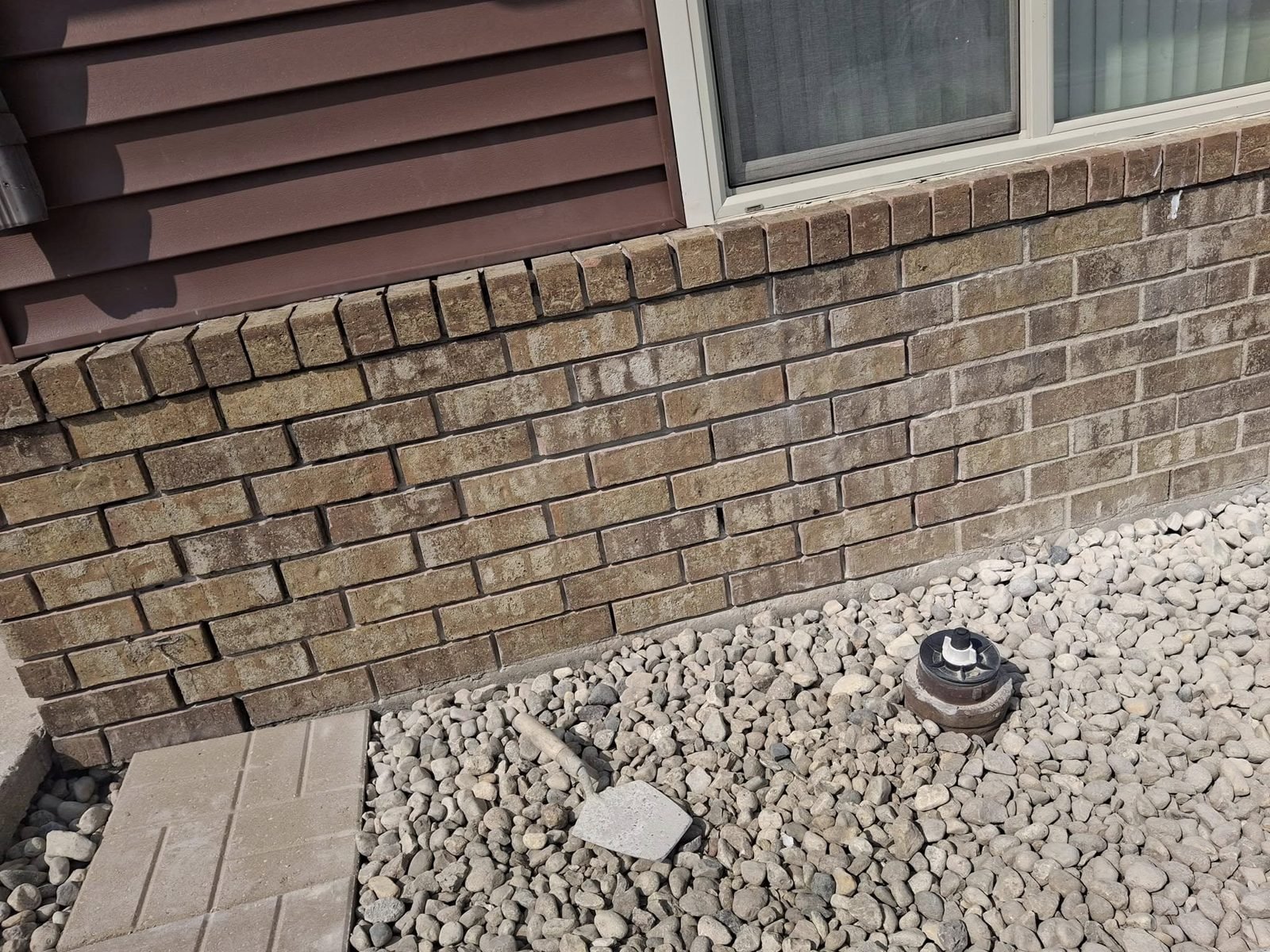 Brick foundation wall with failing mortar joints before tuckpointing — Morris, IL