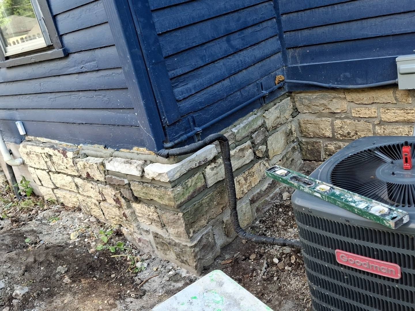 Limestone foundation corner rebuilt — masonry repair in Grundy County, IL
